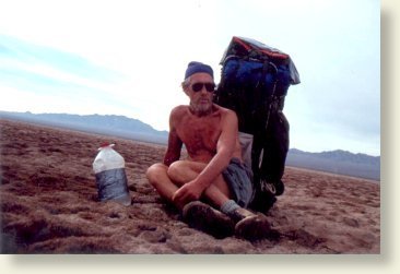 Al Caler shows the wear and tear of days of trekking across barren desert lands. Photo by Lee Bergthold